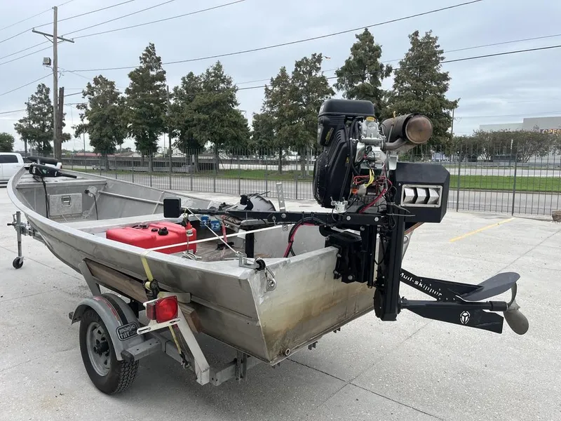 Slide: The Image of Aluminum boat on trailer with outboard motor, Custom model 17, year 2006. - 5