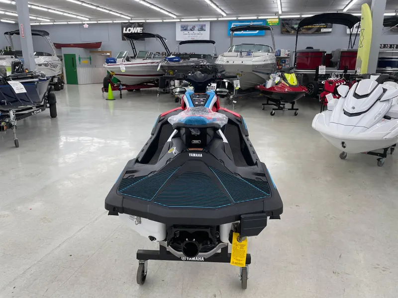 Slide: The Image of 2025 Yamaha WaveRunner JetBlaster DLX 3-Up in showroom, surrounded by various boats. - 6