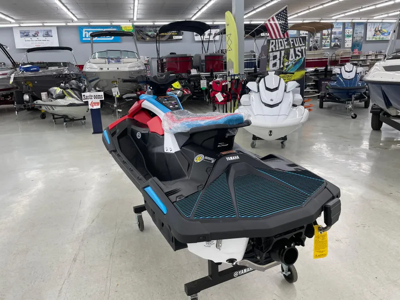 Slide: The Image of 2025 Yamaha WaveRunner JetBlaster DLX 3-Up displayed in a showroom with various boats. - 7