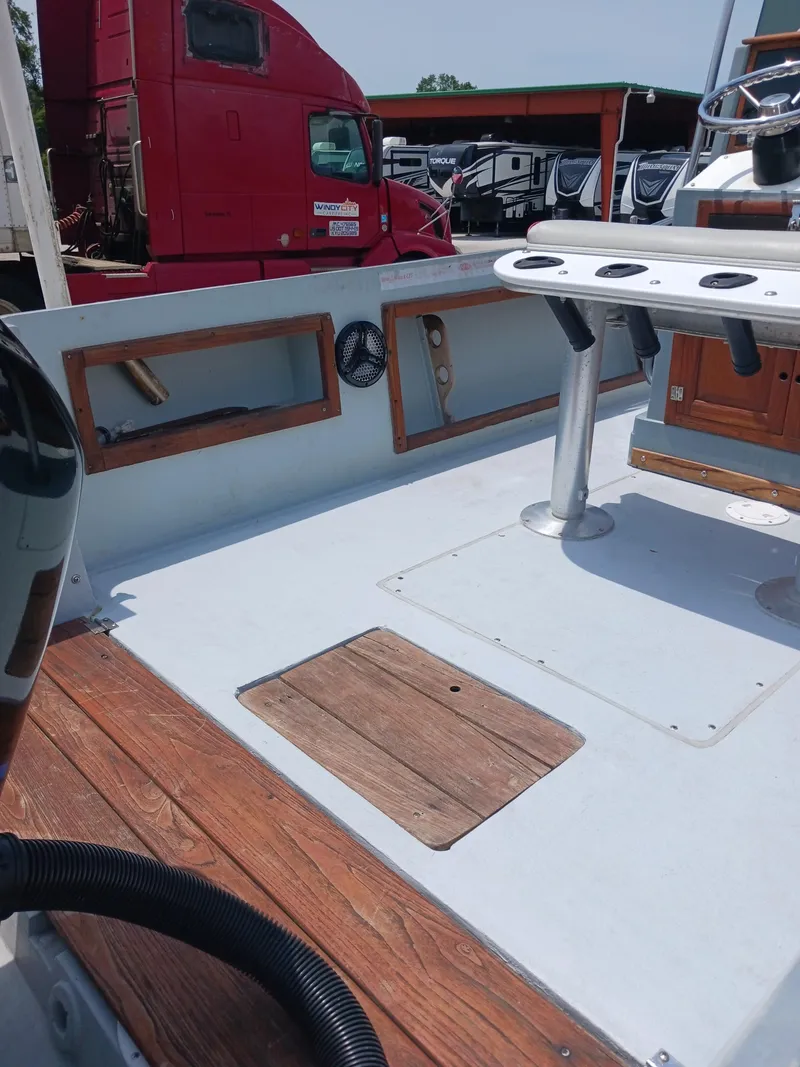 Slide: The Image of 1980 Hydra-Sports 2106 Vector boat interior with wooden accents and steering console. - 11