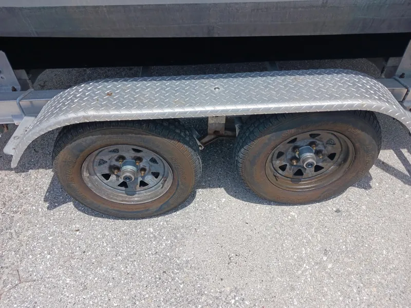 Slide: The Image of Trailer wheels of a 1980 Hydra-Sports 2106 Vector on asphalt. - 22
