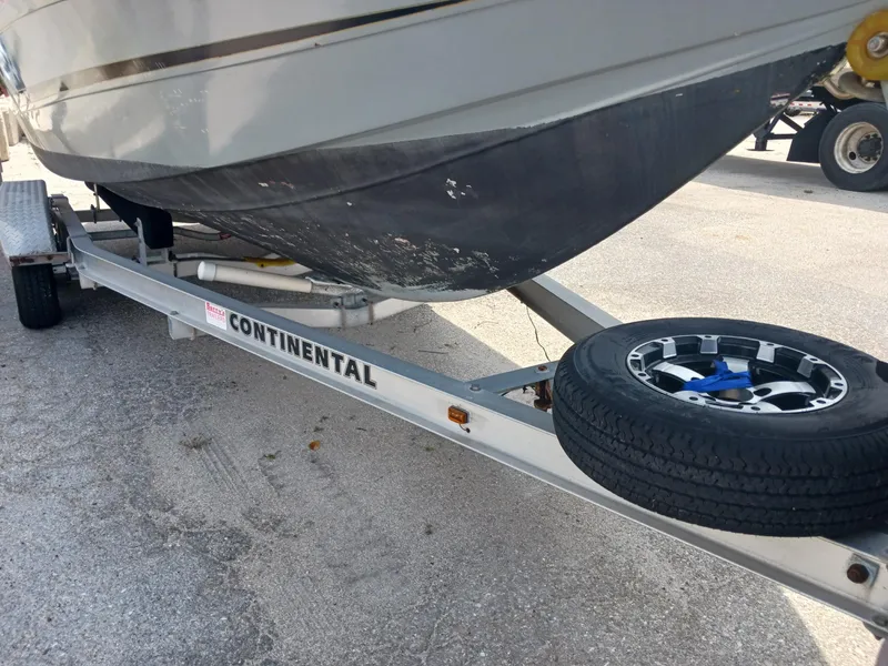 Slide: The Image of 1980 Hydra-Sports 2106 Vector boat on Continental trailer, close-up view. - 23