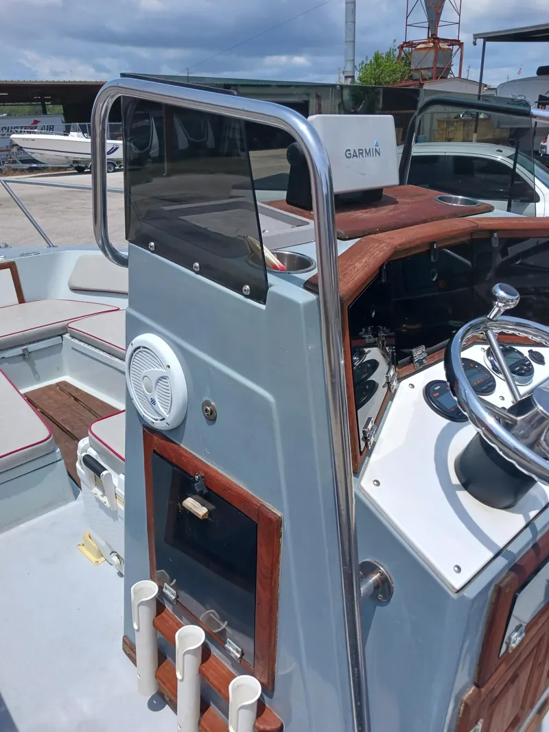 Slide: The Image of 1980 Hydra-Sports 2106 Vector boat cockpit with Garmin navigation system and wooden accents. - 3