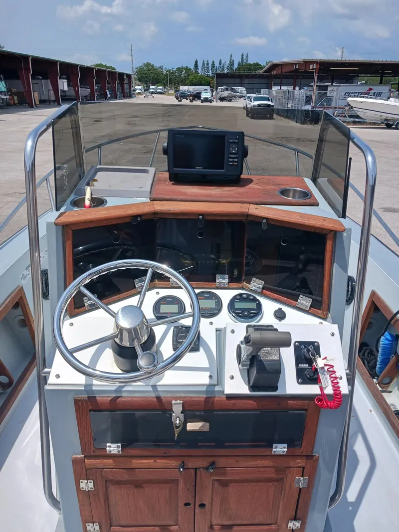 Slide: The Image of 1980 Hydra-Sports 2106 Vector boat dashboard with steering wheel and navigation equipment. - 5