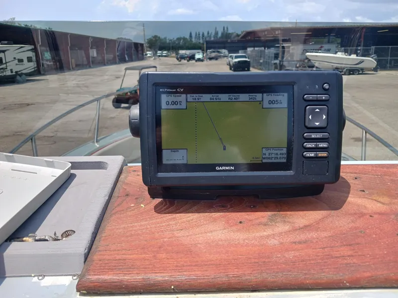 Slide: The Image of Garmin GPS device on 1980 Hydra-Sports 2106 Vector boat dashboard, marina background. - 6