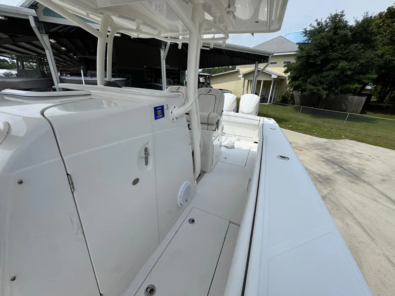 Slide: The Image of 2018 Jupiter 34 HFS boat, white deck, outdoor setting, side view. - 25