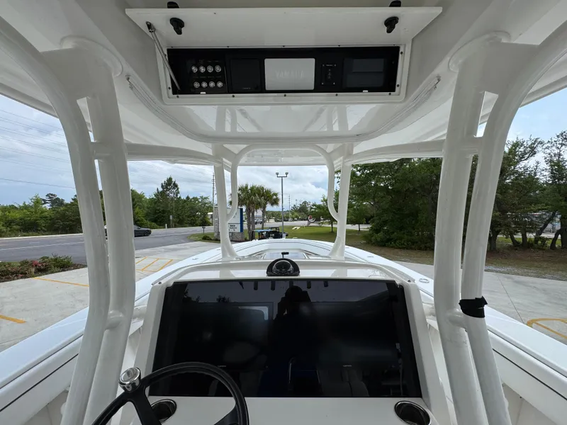 Slide: The Image of 2018 Jupiter 34 HFS boat cockpit with steering wheel and control panel. - 31