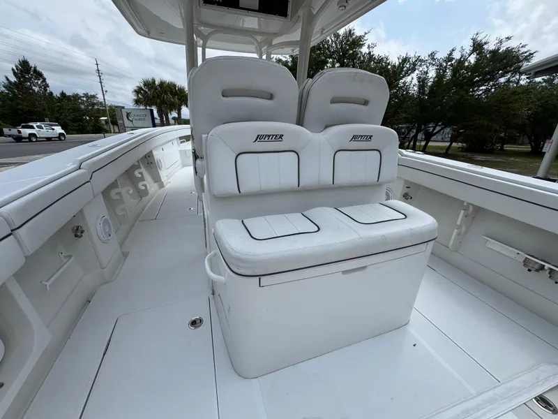 Slide: The Image of 2018 Jupiter 34 HFS boat interior with white seating and spacious deck. - 32