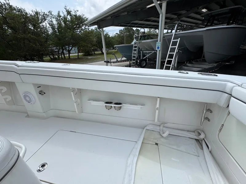 Slide: The Image of 2018 Jupiter 34 HFS boat interior with white seating and storage compartments. - 35