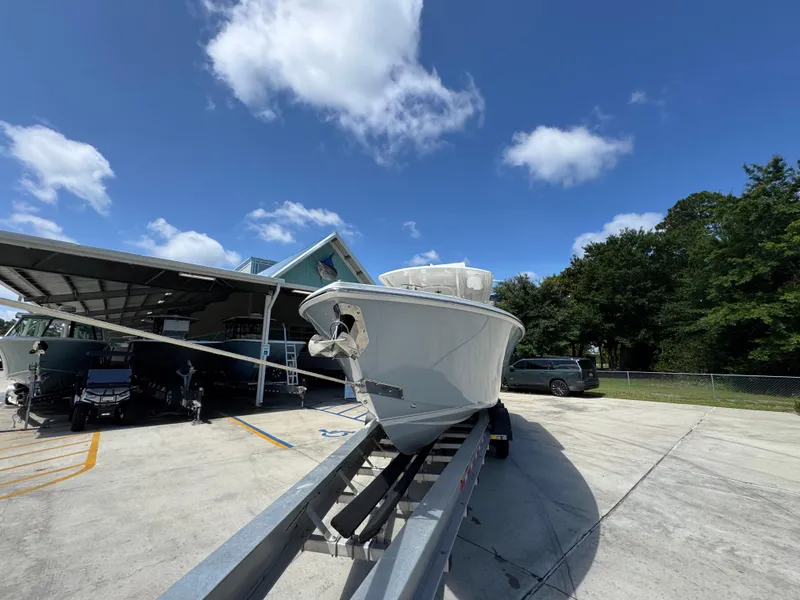 Slide: The Image of 2018 Jupiter 34 HFS boat on trailer under clear blue sky. - 5