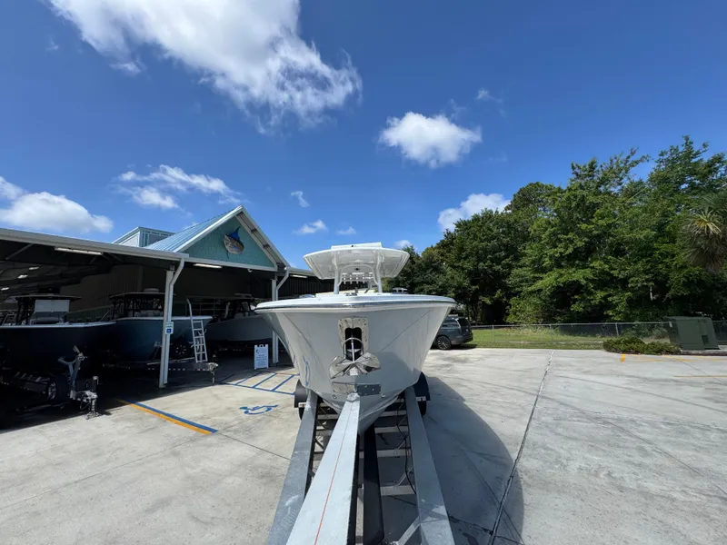 Slide: The Image of 2018 Jupiter 34 HFS boat on trailer under clear blue sky. - 6