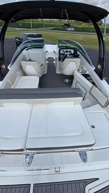 Slide: The Image of 2013 Sea Ray 240 Sundeck boat interior with seating and helm. - 16