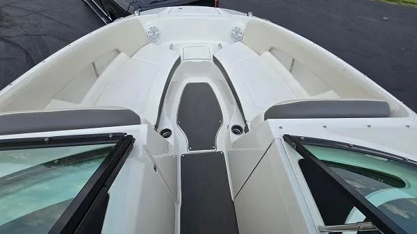Slide: The Image of 2013 Sea Ray 240 Sundeck boat interior with seating and windshield. - 5
