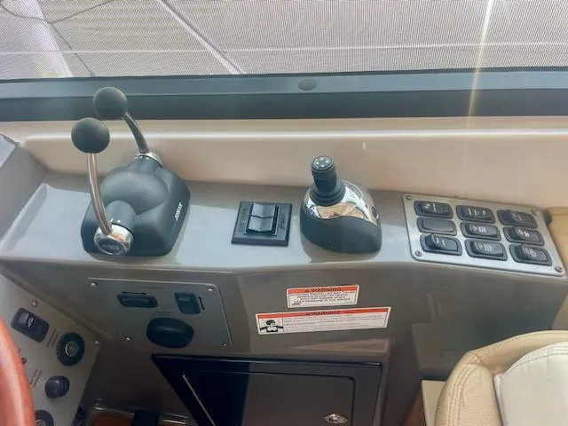 Slide: The Image of Control panel of a 2011 Regal 46 Sport Coupe boat cockpit. - 17