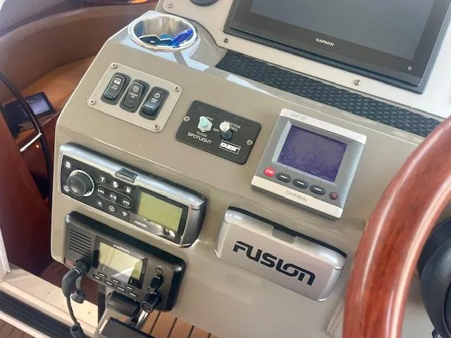 Slide: The Image of Control panel of a 2011 Regal 46 Sport Coupe with navigation and audio systems. - 18