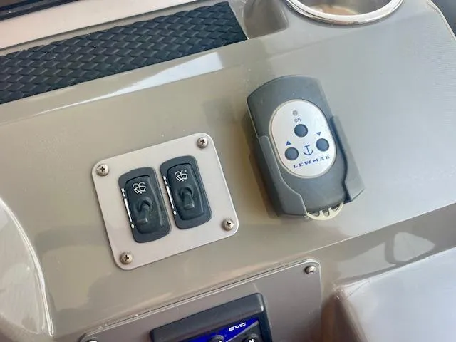 Slide: The Image of Control panel of a 2011 Regal 46 Sport Coupe with switches and Lewmar device. - 19