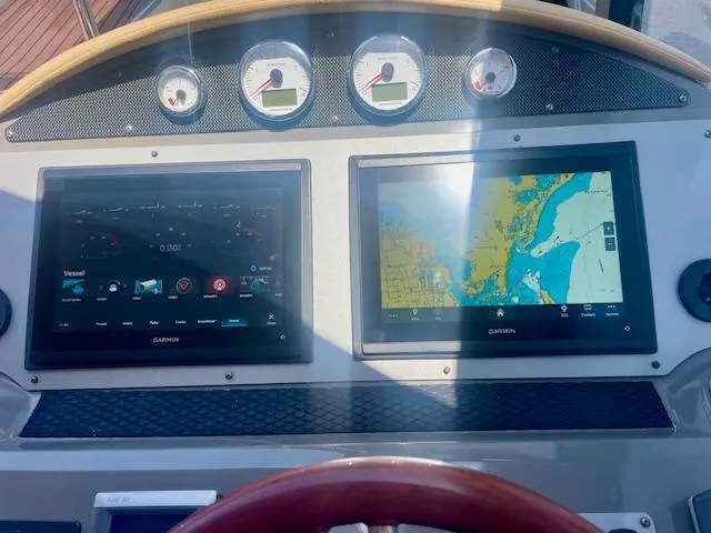 Slide: The Image of Dashboard of 2011 Regal 46 Sport Coupe with navigation screens and gauges. - 21