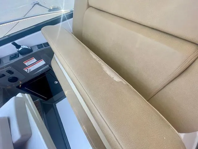 Slide: The Image of 2011 Regal 46 Sport Coupe interior with worn beige seating. - 24