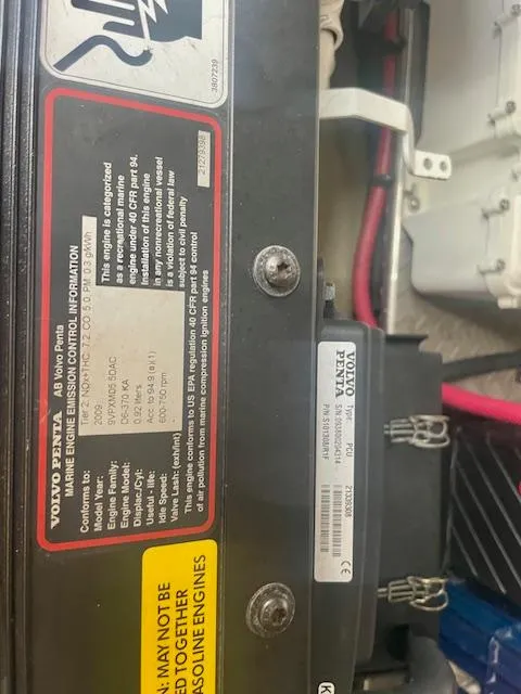 Slide: The Image of Engine compartment of 2011 Regal 46 Sport Coupe with Volvo Penta components and wiring. - 33