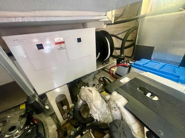 Slide: The Image of Engine room of 2011 Regal 46 Sport Coupe with visible machinery and equipment. - 37