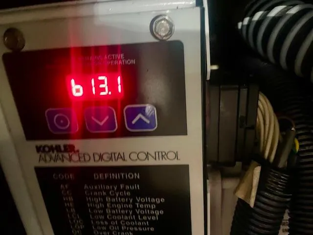 Slide: The Image of Kohler advanced digital control panel displaying 613.1 on a 2011 Regal 46 Sport Coupe. - 39