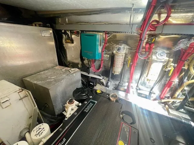 Slide: The Image of Engine room of a 2011 Regal 46 Sport Coupe with visible components and wiring. - 40