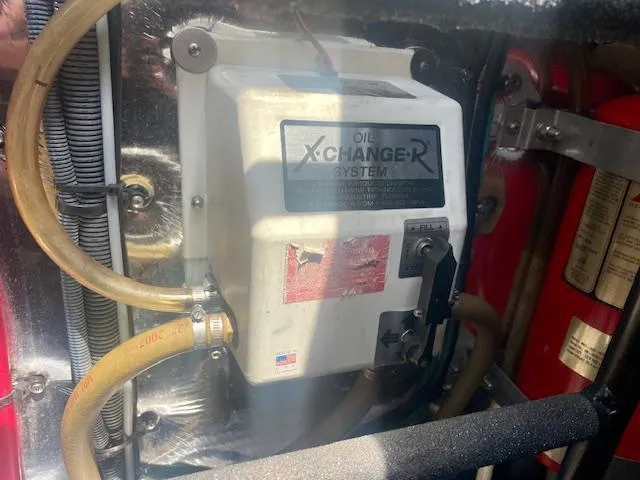 Slide: The Image of Oil X-Changer system in a 2011 Regal 46 Sport Coupe engine compartment. - 41