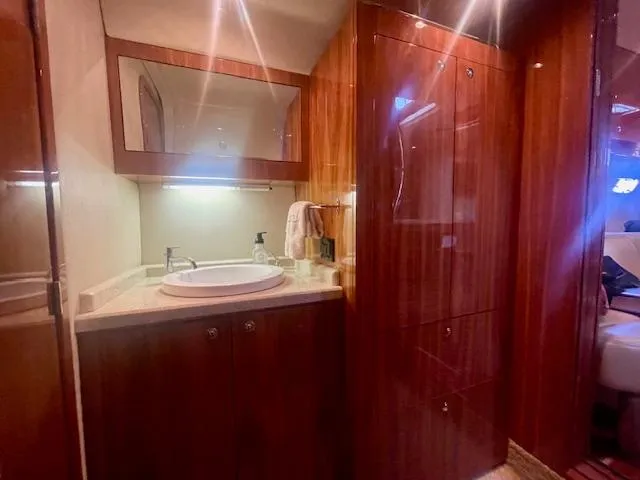 Slide: The Image of Luxurious bathroom interior of 2011 Regal 46 Sport Coupe yacht with wooden cabinetry. - 6