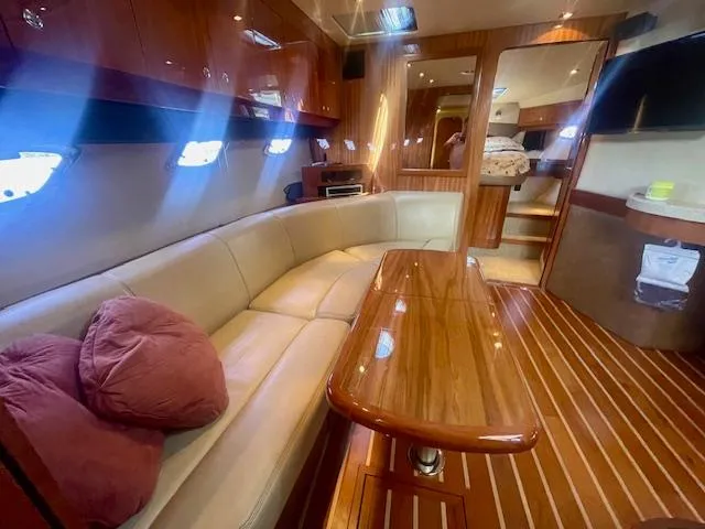 Slide: The Image of Luxurious interior of 2011 Regal 46 Sport Coupe with plush seating and elegant wood finishes. - 9