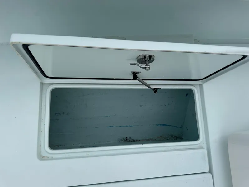 Slide: The Image of Open storage compartment on a 2019 Contender 35 ST boat. - 10