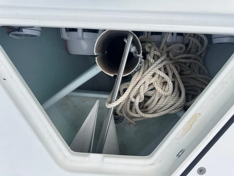 Slide: The Image of Anchor storage compartment with rope on a 2019 Contender 35 ST boat. - 11