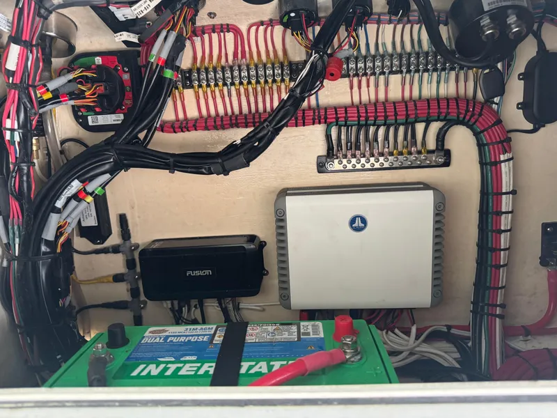 Slide: The Image of Electrical wiring and components inside a 2019 Contender 35 ST boat. - 15