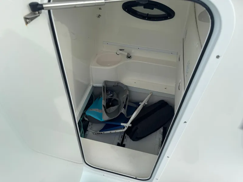 Slide: The Image of Interior cabin of a 2019 Contender 35 ST boat with storage items. - 16