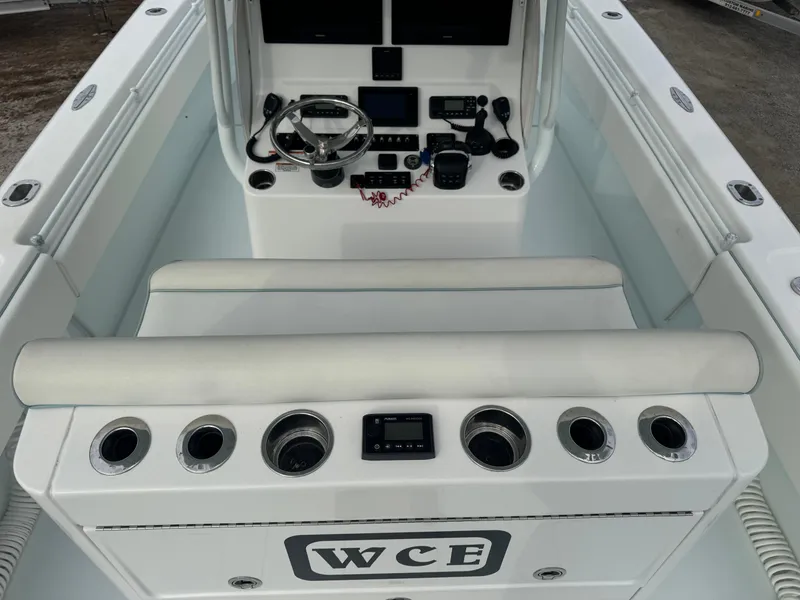 Slide: The Image of 2019 Contender 35 ST boat console with steering wheel and controls. - 22