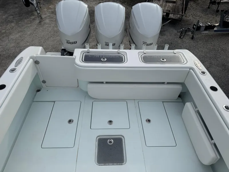 Slide: The Image of 2019 Contender 35 ST boat deck with triple outboard engines. - 29