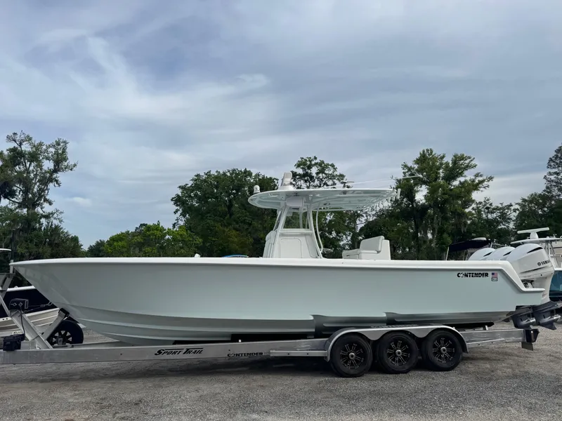 Slide: The Image of 2019 Contender 35 ST boat on trailer, parked outdoors. - 33