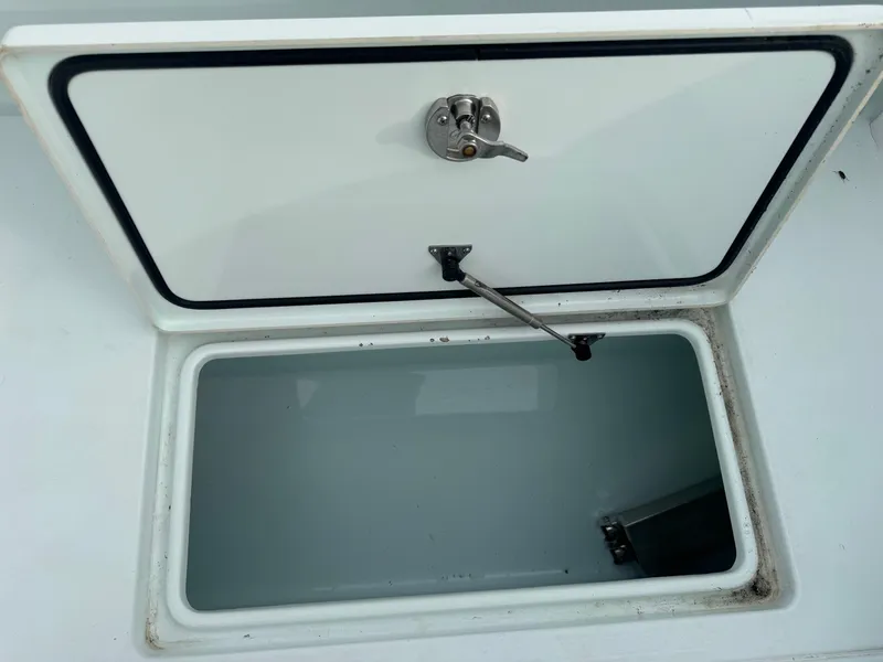 Slide: The Image of Open storage compartment on a 2019 Contender 35 ST boat. - 41