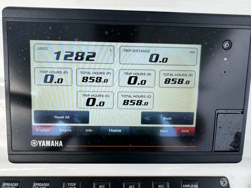 Slide: The Image of Yamaha display showing engine hours and trip data on a 2019 Contender 35 ST boat. - 5