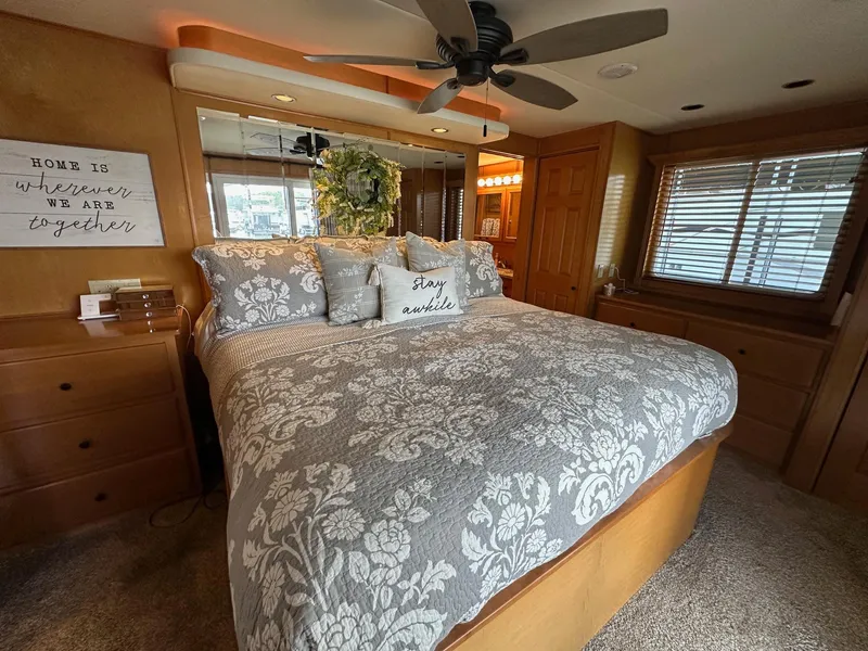 Slide: The Image of Luxurious bedroom in 2008 Starlite 18x85 houseboat with elegant decor and cozy bedding. - 12