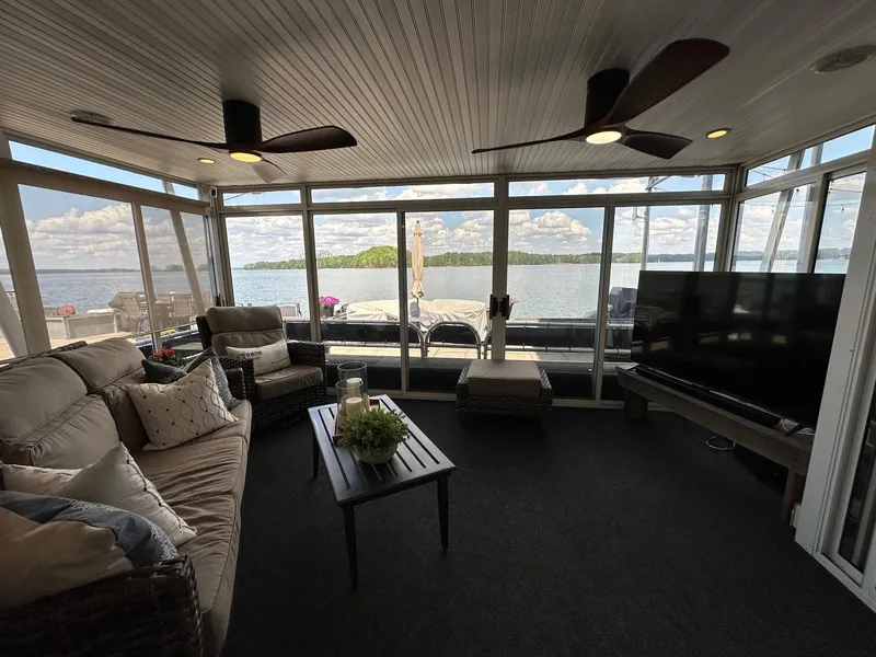 Slide: The Image of Luxurious Starlite 18x85 houseboat interior with lake view, modern furnishings, and large windows, 2008 model. - 2