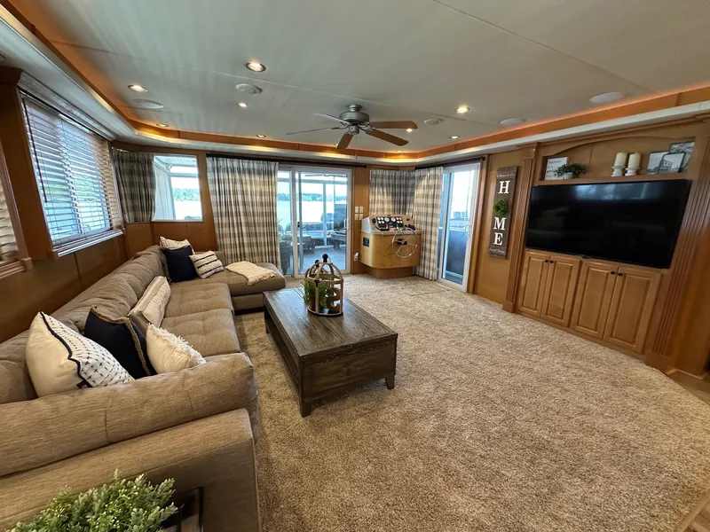 Slide: The Image of Luxurious living room in 2008 Starlite 18x85 houseboat with plush seating and large TV. - 4