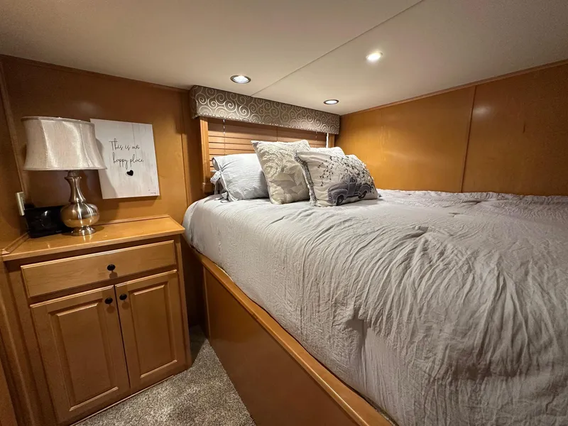 Slide: The Image of Cozy bedroom in 2008 Starlite 18x85 houseboat with wooden cabinetry and soft lighting. - 7