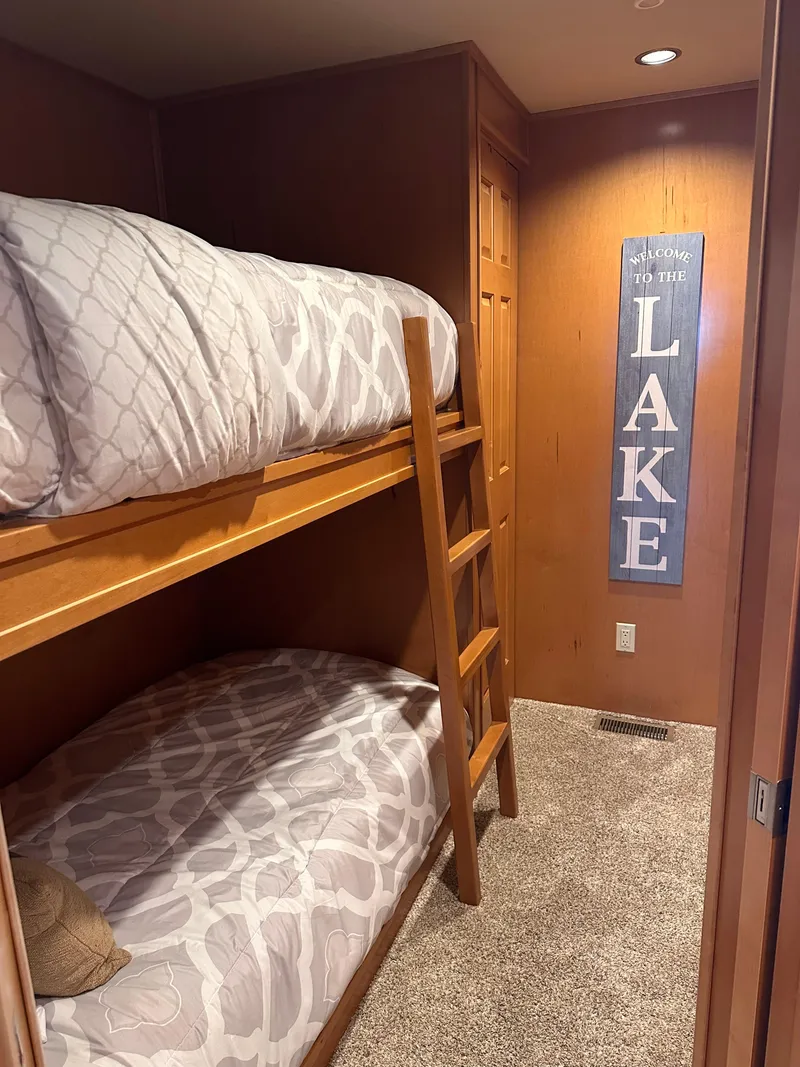 Slide: The Image of Bunk beds in cozy room with "Lake" sign, Starlite 18x85, 2008 model. - 8