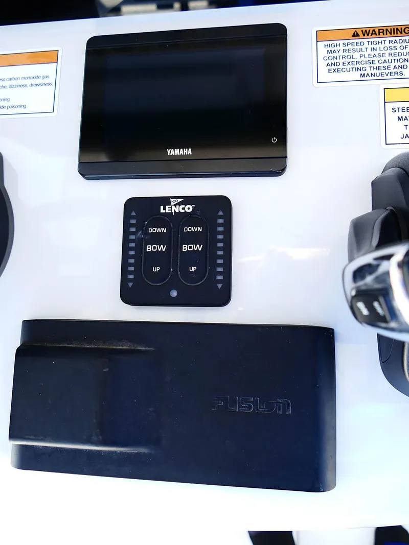Slide: The Image of Control panel of a 2022 Contender 25 Bay boat with Yamaha and Lenco systems. - 12