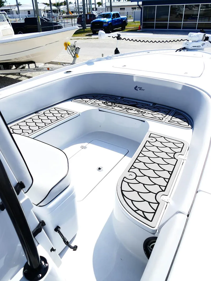 Slide: The Image of 2022 Contender 25 Bay boat interior with stylish seating and deck design. - 18