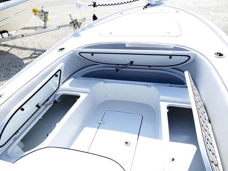Slide: The Image of 2022 Contender 25 Bay boat interior with open storage compartments. - 20