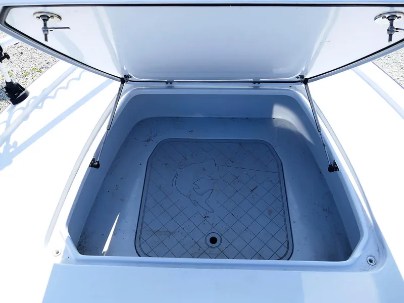 Slide: The Image of Open storage compartment on 2022 Contender 25 Bay boat. - 22
