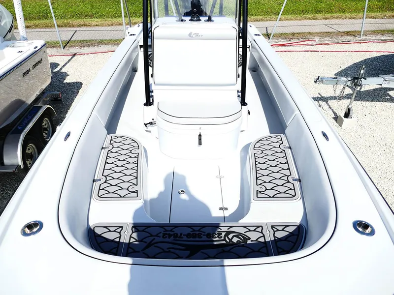 Slide: The Image of 2022 Contender 25 Bay boat interior with seating and storage compartments. - 25