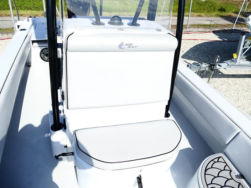 Slide: The Image of 2022 Contender 25 Bay boat interior with seating and console, showcasing sleek design and functionality. - 27