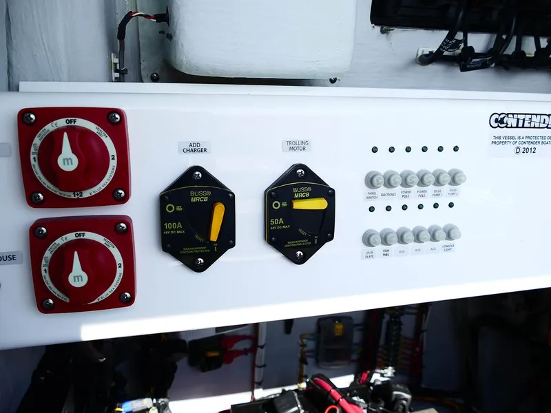 Slide: The Image of Electrical panel of 2022 Contender 25 Bay boat with switches and meters. - 31